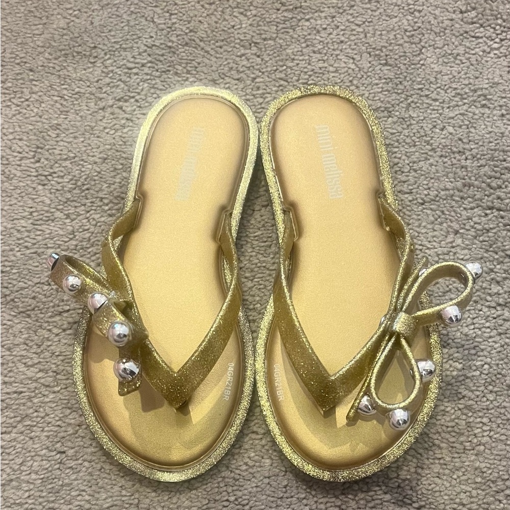 Gold mini Melissa flip flops